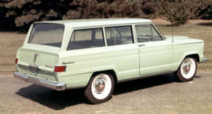 Stunning Jeep Wagoneer In A Majestic Landscape Wallpaper