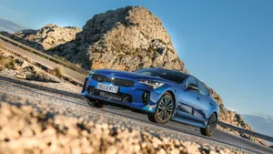 Stunning Kia Stinger Sports Sedan In Action Wallpaper