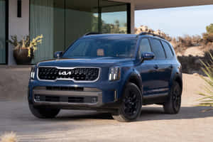 Stunning Kia Telluride On A Majestic Mountain Road Wallpaper