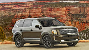 Stunning Kia Telluride On A Scenic Mountain Road Wallpaper