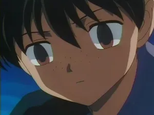 Stunning Kohaku Koi Swimming Gracefully In A Pond Wallpaper