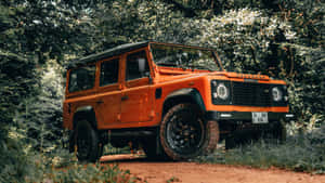 Stunning Land Rover Defender On Rugged Terrain Wallpaper