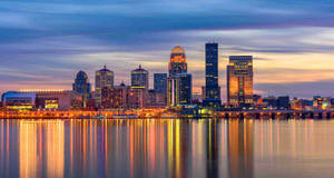 Stunning Louisville City Lights At Twilight Wallpaper