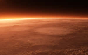 Stunning Mars Landscape With A Dominating Red Planet Wallpaper