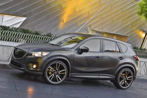 Stunning Mazda Cx-5 In Motion Showcasing Its Sleek Design Wallpaper