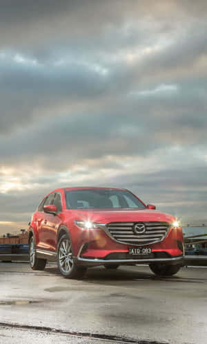 Stunning Mazda Cx-9 Driving Through The City Wallpaper