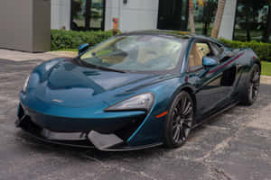 Stunning Mclaren 570gt Showcasing Its Sleek Design And Powerful Stance On A Picturesque Day. Wallpaper