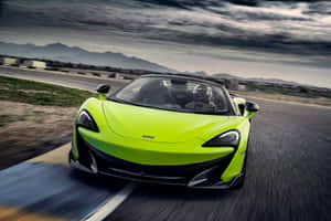 Stunning Mclaren 600lt Spider Cruising On The Road Wallpaper