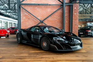 Stunning Mclaren 675lt Spider Cruising On The Open Road Wallpaper