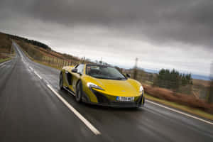 Stunning Mclaren 675lt Spider Cruising On The Open Road Wallpaper