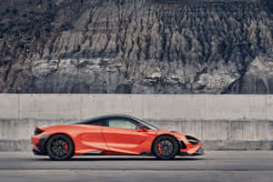 Stunning Mclaren 765lt In Motion On The Open Road Wallpaper