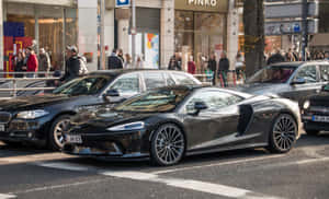 Stunning Mclaren Gt Dominating The Road Wallpaper