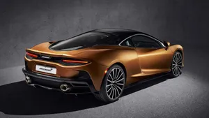 Stunning Mclaren Gt On The Open Road Wallpaper