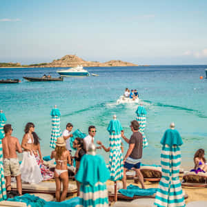 Stunning Mediterranean Beach At Sunset Wallpaper