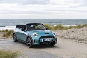 Stunning Mini Cooper Convertible On Scenic Road Wallpaper