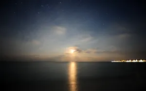 Stunning Moonset Against Blue Night Sky Wallpaper