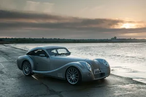 Stunning Morgan Sports Car On Scenic Road Wallpaper