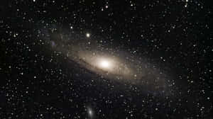 Stunning Nature Scene Of Rolling Green Hills With A River In The Background Wallpaper