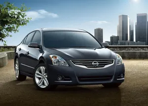 Stunning Nissan Altima Cruising On The Open Road Wallpaper