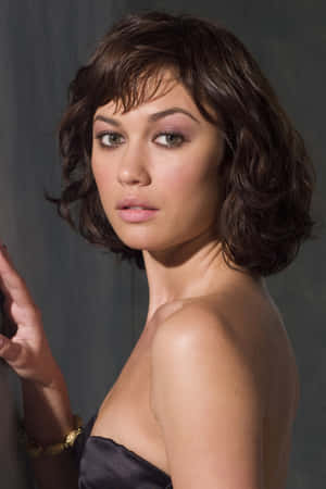 Stunning Olga Kurylenko Posing Elegantly Wallpaper