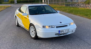 Stunning Opel Calibra In Dynamic Action Wallpaper