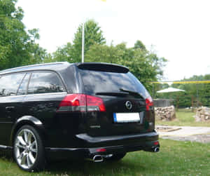 Stunning Opel Vectra Spearing Down The Road Wallpaper