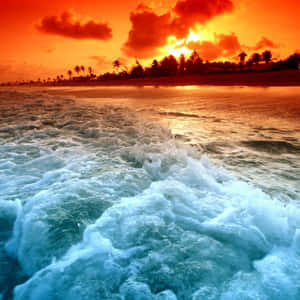 Stunning Orange Sunset Over The Beach Wallpaper