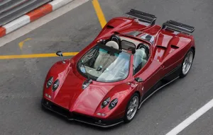Stunning Pagani Zonda C12 Roadster Cruising On An Open Road Wallpaper