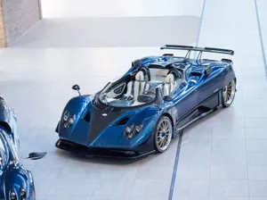 Stunning Pagani Zonda Hp Barchetta In Motion On A Race Track Wallpaper