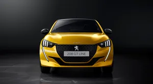 Stunning Peugeot 208 In Vibrant Environment Wallpaper
