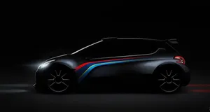 Stunning Peugeot 208 In Vibrant Red Color Wallpaper