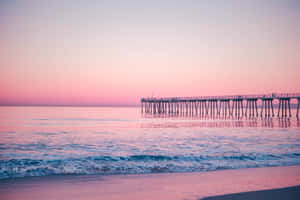 Stunning Pink Sand Beach At Sunset Wallpaper