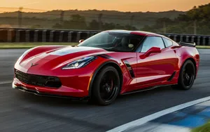 Stunning Red Chevrolet Corvette Grand Sport On The Road Wallpaper