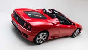 Stunning Red Ferrari 360 Modena In Action Wallpaper