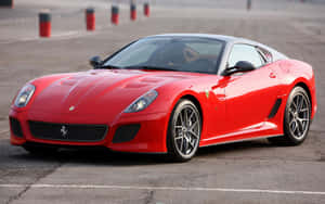 Stunning Red Ferrari 599 Gtb Fiorano Showcasing Its Beauty And Power Wallpaper