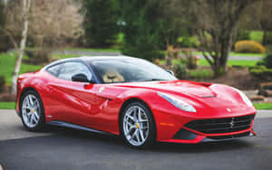 Stunning Red Ferrari F12 Berlinetta In Motion Wallpaper