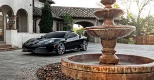 Stunning Red Ferrari Ff On The Road Wallpaper