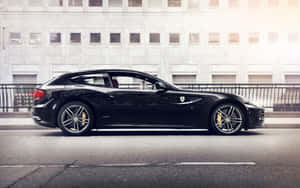 Stunning Red Ferrari Ff Parked Near City Skyline. Wallpaper