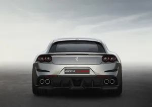 Stunning Red Ferrari Gtc4lusso In Outdoor Setting Wallpaper