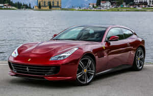 Stunning Red Ferrari Gtc4lusso On A Scenic Drive Wallpaper