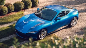 Stunning Red Ferrari Roma Cruising The Streets Wallpaper