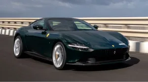 Stunning Red Ferrari Roma Gliding On An Open Road Wallpaper
