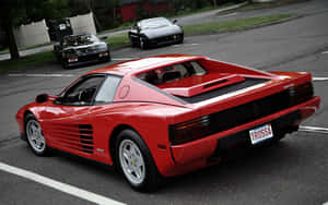 Stunning Red Ferrari Testarossa On An Open Road Wallpaper