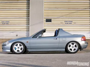 Stunning Red Honda Civic Del Sol On The Road Wallpaper