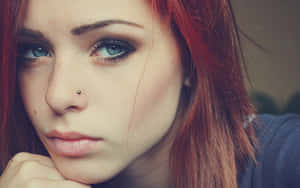 Stunning Redhead Girl Showcasing Unique Piercing Wallpaper