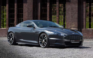 Stunning Silver Aston Martin Db9 On The Race Track Wallpaper