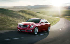 Stunning Silver Cadillac Ats Parked Under Blue Sky Wallpaper