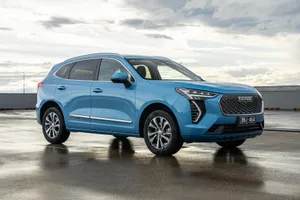 Stunning Silver Haval Suv Cruising On A Scenic Coastal Road Wallpaper