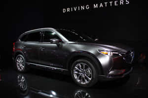 Stunning Silver Mazda Cx-9 On The Road Wallpaper