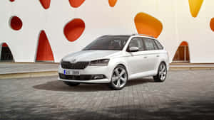 Stunning Silver Škoda Fabia Parked Against An Urban Background Wallpaper